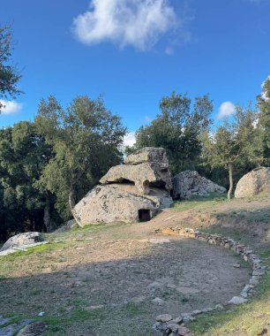 Domus de janas of S'Abba Bogada pre-nuragic and nuragic necropolis of Ovodda, Sardini clipart