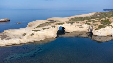 aerial view of the rock of S'Archittu di Santa Caterina in the province of Oristano, Sardinia, Italy clipart