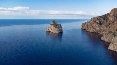 Aerial view of the Pan di Zucchero rock and Masua beach on the west coast of Sardinia clipart