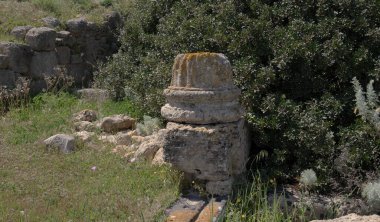 Remains of ancient walls and structures at the kerkouane unesco world heritage site in Oristano, Sardinia, Italy clipart