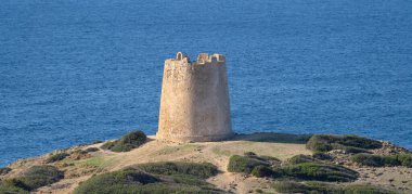 Piscinni or Pisxinni beach and Spanish tower in Teulada in southern Sardini clipart