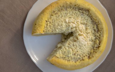 casu marzu or rotten cheese - typical Sardinian cheese containing live insect larvae that create a pungent aroma clipart