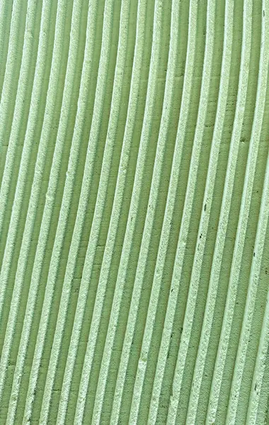 Dikey bej çizgileri ve yumuşak gölgeleri olan desenli yüzey, soyut mimari arka grup