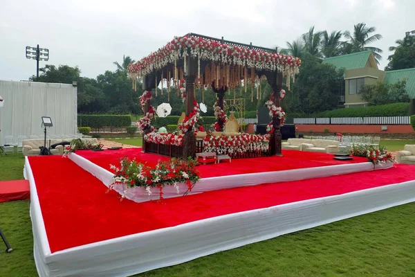 India Wedding event stage decorated with flower, chair, light