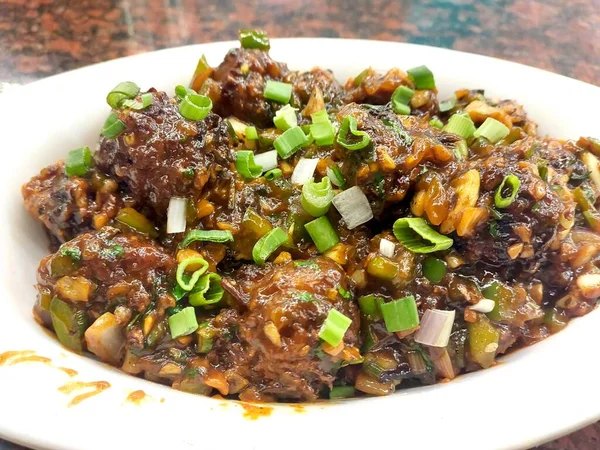 印度菜蔬菜满洲 Indian Cuisine Vegetable Manchurian 也被称为 戈壁满洲 Gobi Manchurian 是一种受欢迎的印度支那街头食品 — 图库照片