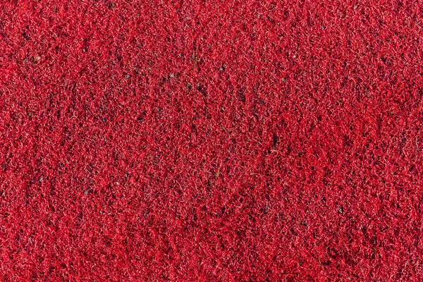 Red Plastic Synthetic Artificial Grass Background Texture Which Used Child — Stock Photo, Image
