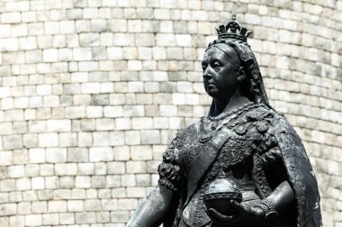 Queen Victoria memorial bronze statue outside Windsor Castle in Berkshire, England, UK which is a popular tourist holiday travel destination and landmark attraction, stock photo image clipart