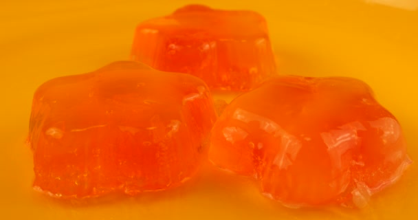 Wobbly Jelly Hitting Spoon Berry Gelatin Jelly Orange Background — Stock Video