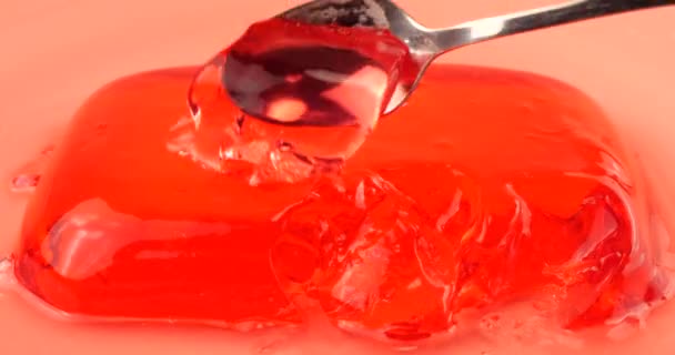 Berry Gelatin Jelly Pink Background Pieces Jelly Spoon — Stock Video