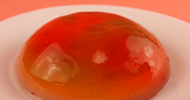Multi Colored Gelatin Jelly Plate Pink Background Wobbly Jelly Hitting — Stock Video