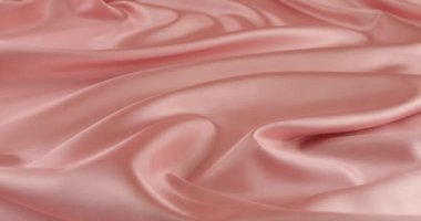 Beyaz kuğu tüyleri pastel pembe ipeğe düşer. Yavaş çekim.