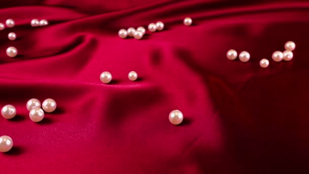 White Swan Feathers Fall Red Silk Pearls Slow Motion — Stock Video