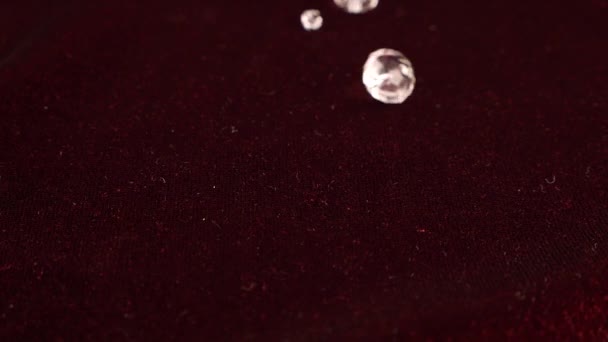 Transparent Jewelry Crystals Fall Burgundy Velvet Slow Motion — Vídeo de stock