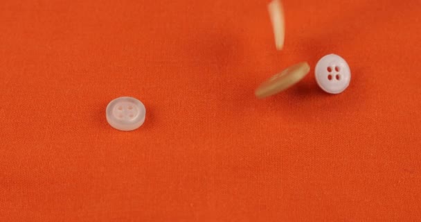 Plastic Multi Colored Buttons Fall Orange Cotton Fabric — Stok video