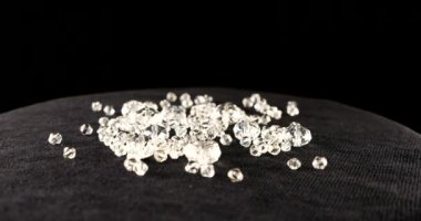 Clear white jewelry crystals and rhinestones on black velvet.