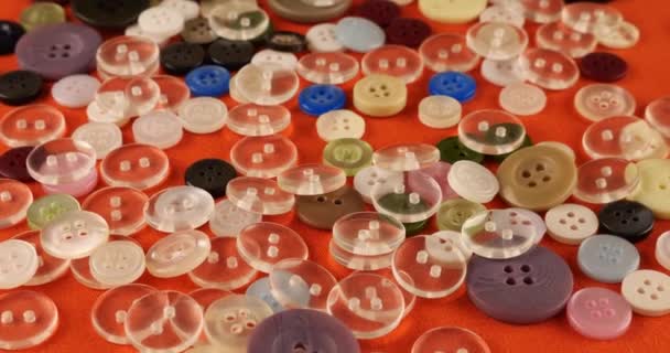 Plastic Multi Colored Buttons Orange Cotton Fabric — Stok video