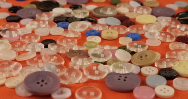 Plastic Multi Colored Buttons Orange Cotton Fabric — Wideo stockowe