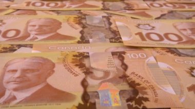 Canadian 100 dollar polymer banknotes with a portrait of Robert Borden.