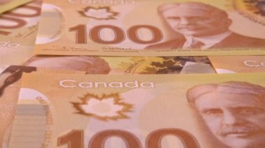 Canadian 100 dollar polymer banknotes with a portrait of Robert Borden.