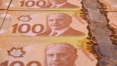 Canadian 100 dollar polymer banknotes with a portrait of Robert Borden.