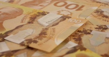 Canadian 100 dollar polymer banknotes with a portrait of Robert Borden.