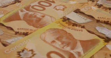 Canadian 100 dollar polymer banknotes with a portrait of Robert Borden.