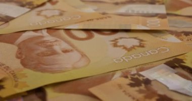 Canadian 100 dollar polymer banknotes with a portrait of Robert Borden.