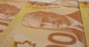 Canadian 100 dollar polymer banknotes with a portrait of Robert Borden.