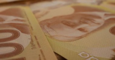 Canadian 100 dollar polymer banknotes with a portrait of Robert Borden.