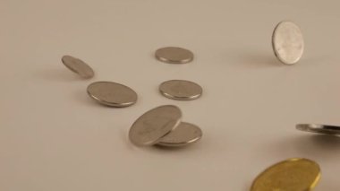 Falling Canadian coins. Slow motion.
