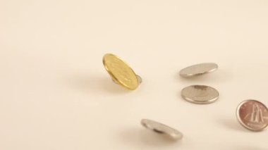 Falling Canadian coins. Slow motion.