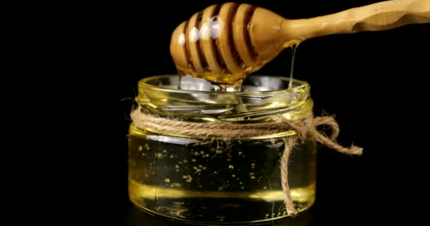 Honey Flows Spoon Spindle Jar Honey Black Background — Video
