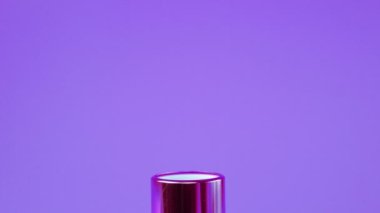 Lipstick on a violet background.