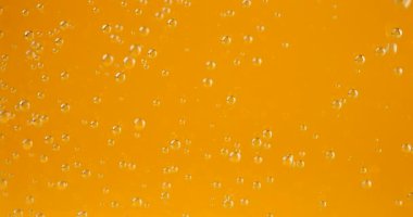 Air bubbles on an orange background.