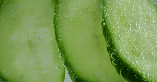 Slices Fresh Cucumbers Clear Water Air Bubbles — Stockvideo