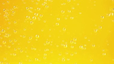 Air bubbles on an orange background.
