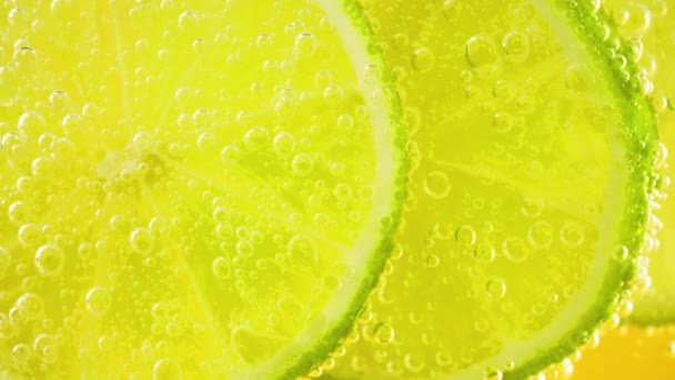 Slice Ripe Lime Air Bubbles Orange Background — Video