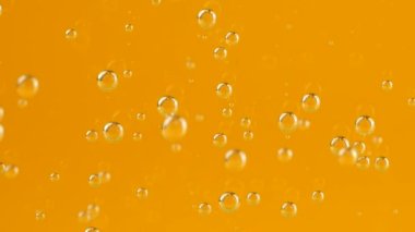 Air bubbles on an orange background.