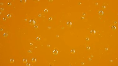 Air bubbles on an orange background.