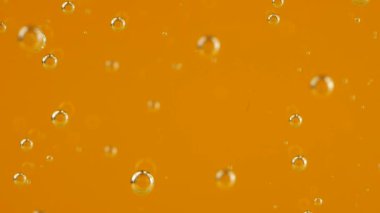 Air bubbles on an orange background.