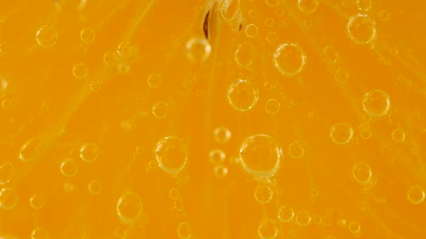 Slice Ripe Orange Water Bubbles Orange Background — Αρχείο Βίντεο