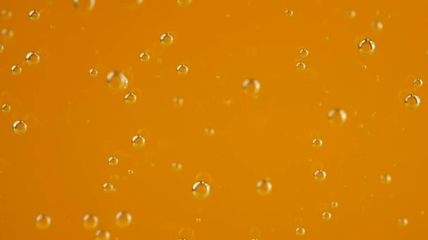 Luftblasen Auf Orangefarbenem Hintergrund — Stockvideo