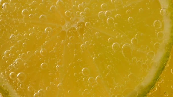 Ripe Lime Slices Air Bubbles Orange Background — Stock videók