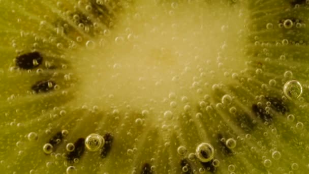 Ripe Kiwi Slices Air Bubbles Orange Background — Wideo stockowe