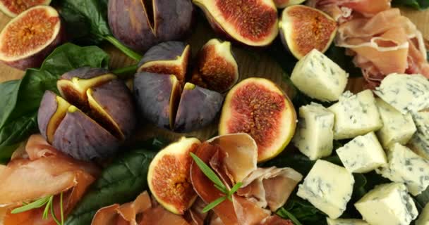 Figs Jamon Spinach Leaves Blue Cheeses Wooden Board Snacks Set — Stock Video