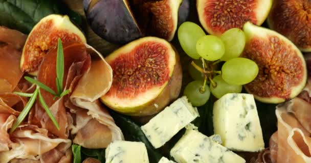 Figs Jamon Spinach Leaves Grapes Blue Cheeses Wooden Board Snacks — Stock Video