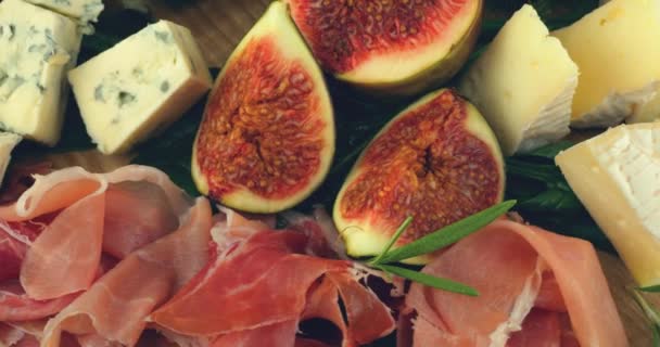 Figs Jamon Spinach Leaves Blue Cheeses Wooden Board Snacks Set — Stock Video