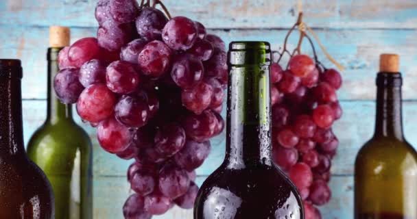 Pink Grapes Wine Bottles Blue Vintage Wooden Background — Stock Video