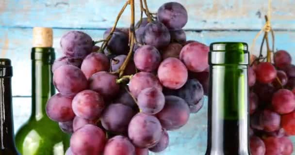 Pink Grapes Wine Bottles Blue Vintage Wooden Background — Stock Video