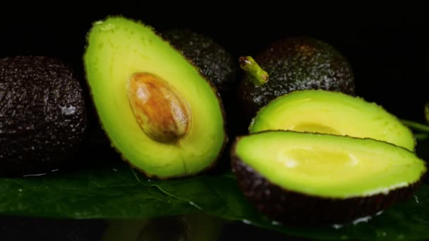 Drops Water Fall Avocado Fruits Leaves Black Background Raw Fruits — Stock Video